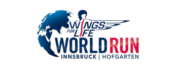 Weltkugel mit einer Person mit Flügel und Schriftzug | © Wings for Life World Run | Maria Krumm