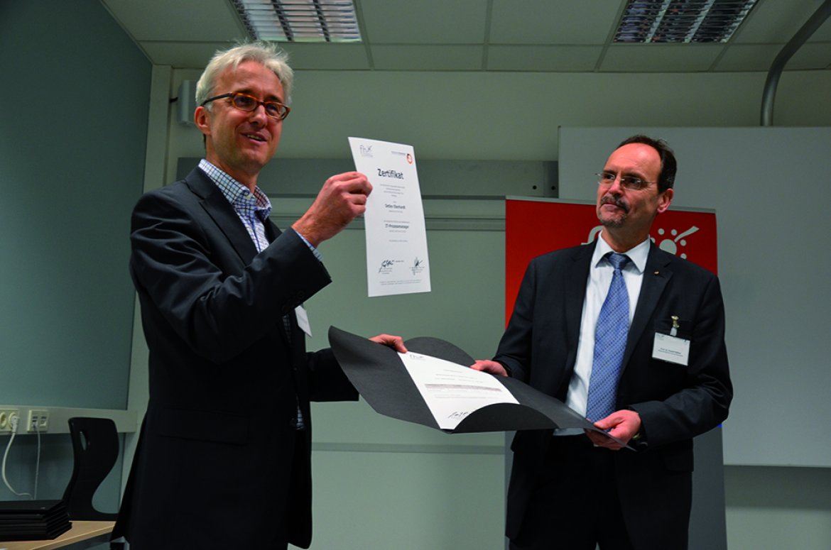 Bild von Prof. Dr. Rudolf Bässler (FH Rosenheim) und Prof. (FH) Dr. Martin Adam (FH Kufstein Tirol)